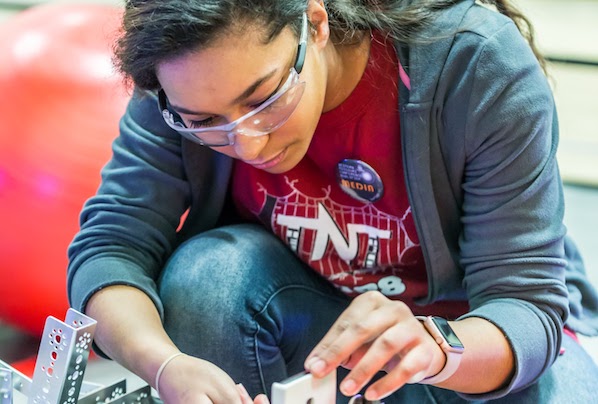 Girl working on robot