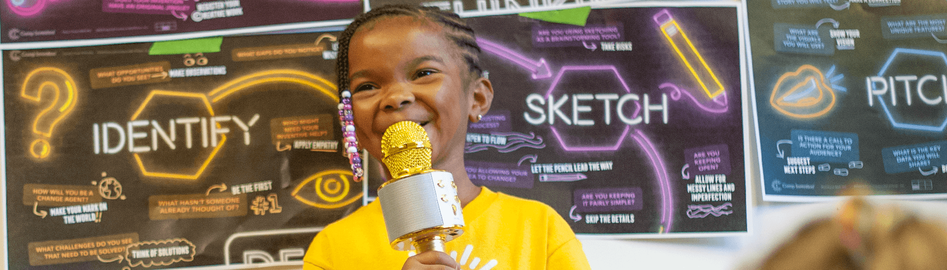 Young person holding a DIY microphone