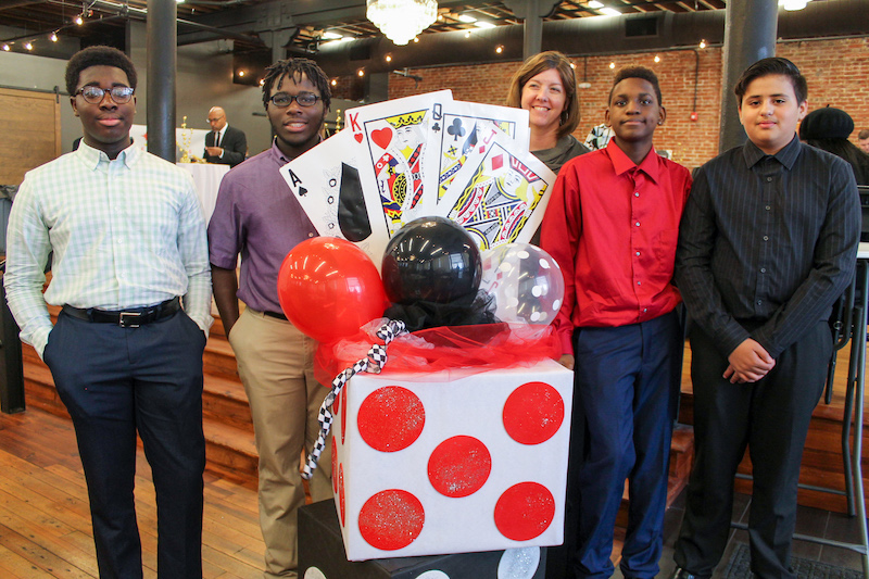 4 boys and their teacher