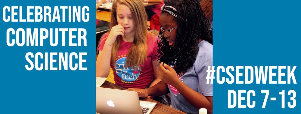 Two middle school girls working together on a laptop computer