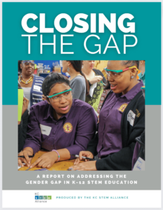 A report cover featuring a photo of two high school women wearing safety glasses as they work at a table with tools. The title reads: Closing the Gap: A Report on addressing the gender gap in K-12 STEM education.